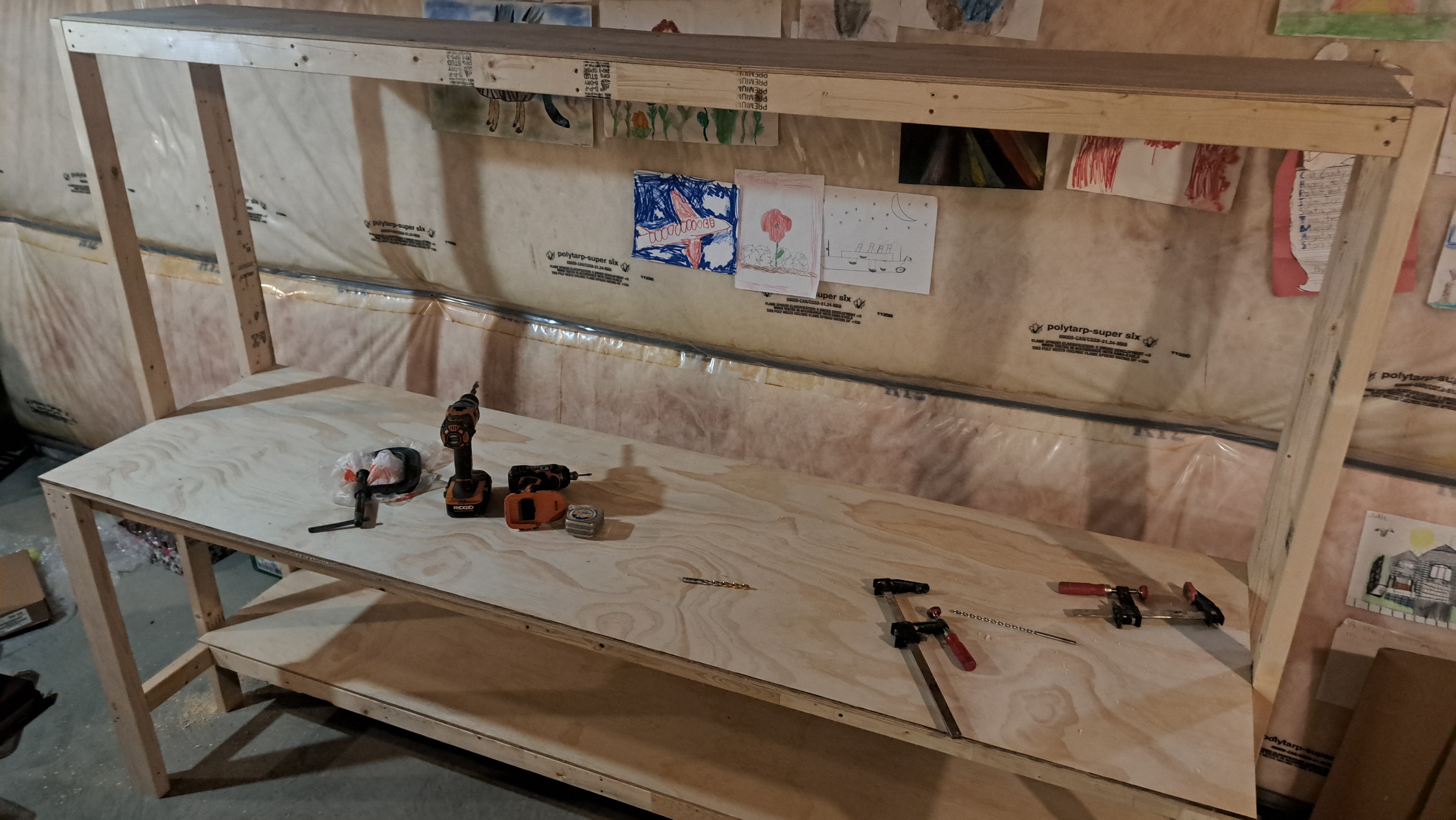 Adding the sanded plywood tabletop and the upper shelf.